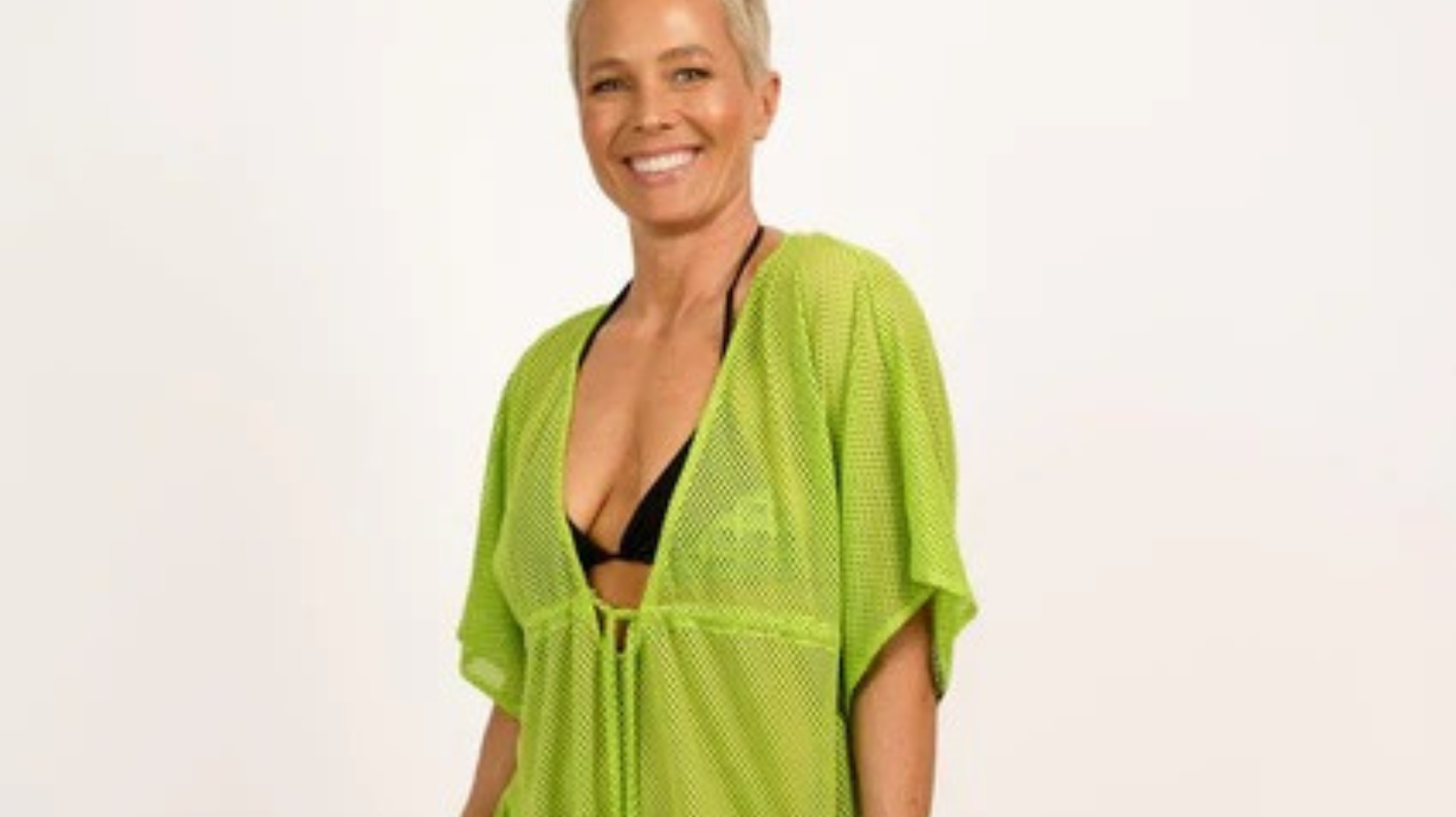 Woman wearing Hermosa Cover Up in Lime — light green resort-style swim cover up from Neon Skull